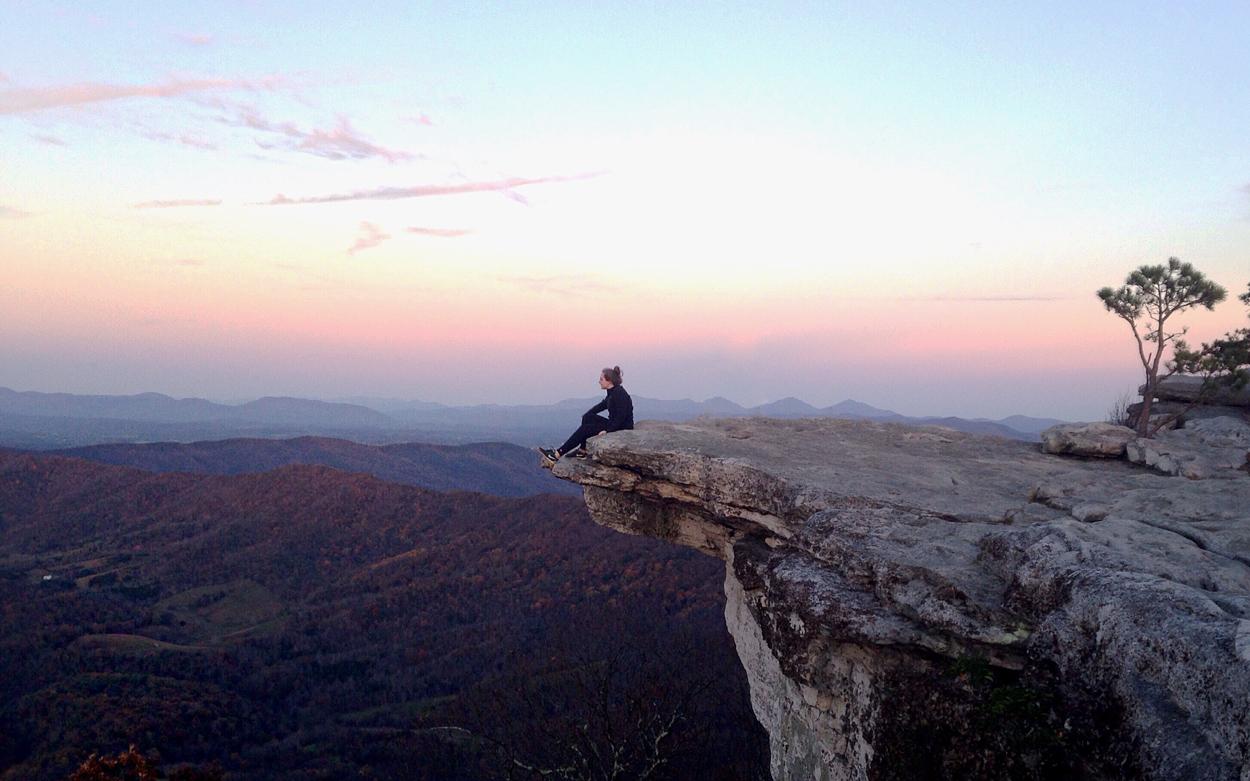 Student sits at McAfee Knob for sunrise