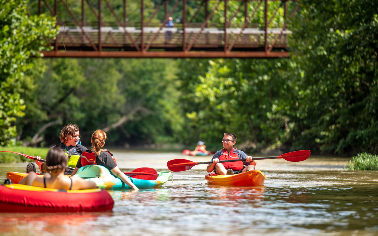 students kayaking along the Roanoke River