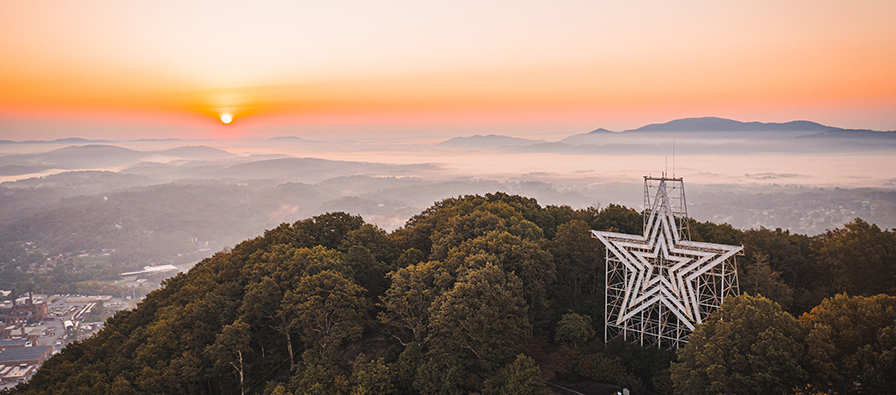 Roanoke Star at sunrise with mountains beyond