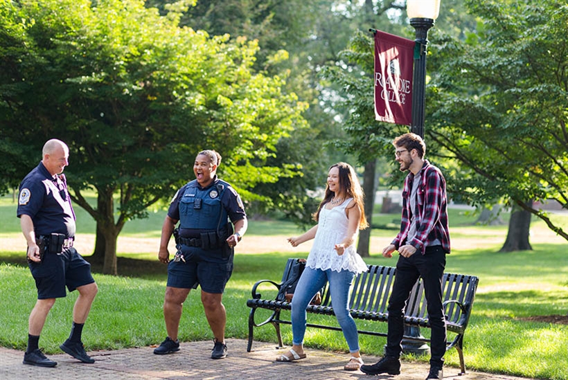 Students dancing with campus safety