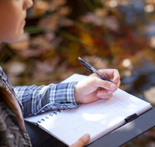 Student taking notes