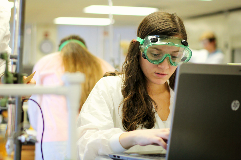 Student working on a laptop during a lab